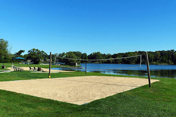 sand volleyball court available at lamberton lake apartments 